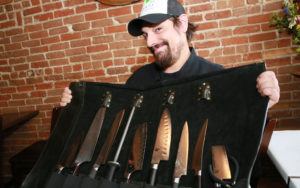 Kevin Kidd, Executive Chef and co-owner of 24 Carrot Bistro displays his set of knives.