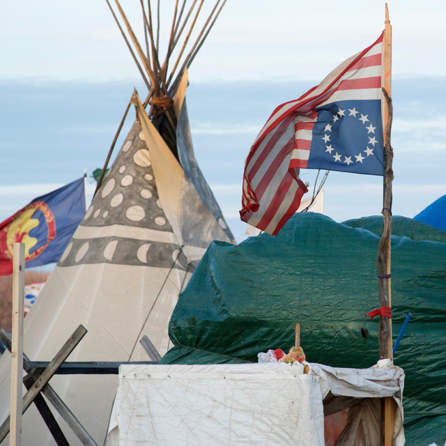 The official signal of distress is an appropriate symbol for the DAPL protests, and one found frequently in the camps. 